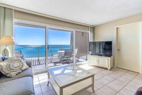 Bright, modern D404 living room at The Beach House Condominiums with balcony and ocean view.