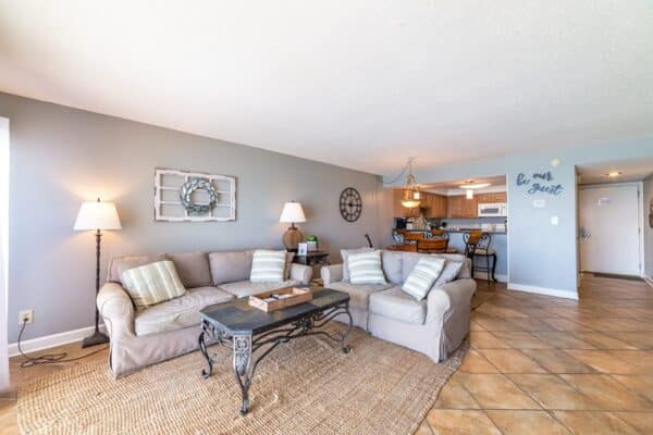 D602 décor in a spacious living room leading to an open kitchen at The Beach House Condominiums.