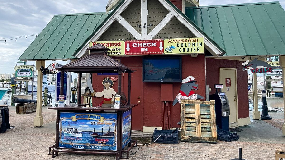 Check-in booth and info kiosk for pirate cruise and dolphin tour at The Beach House Condominiums.