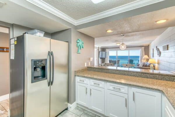 Kitchen in B502 Beach House Condominiums, featuring an open layout and ocean view.